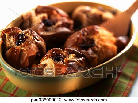 Stock Image - Baked apples in dish, close-up. Fotosearch