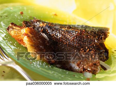 Blackened trout on green plate, close-up View Large Photo Image Stock Photography - Blackened trout on green plate, close-up. Fotosearch
