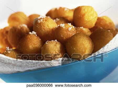 Bowl of dauphine potatoes sprinkled with sea salt, close-up View Large Photo Image Stock Photograph - Bowl of dauphine potatoes sprinkled with sea salt, close-up. Fotosearch