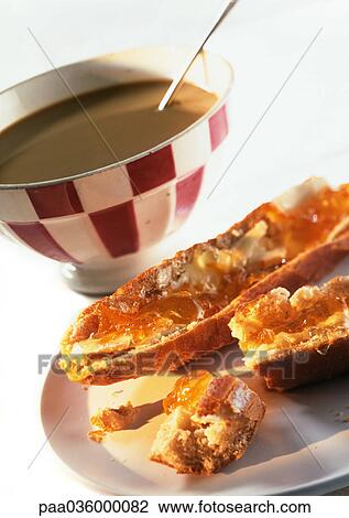 Bowl of hot chocolate and pieces of bread with butter and jelly, close-up View Large Photo Image Stock Image - Bowl of hot chocolate and pieces of bread with butter and jelly, close-up. Fotosearch