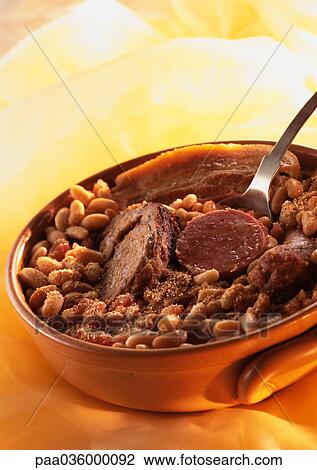Cassoulet (french meat and bean stew) in casserole dish, close-up View Large Photo Image Stock Image - Cassoulet (french meat and bean stew) in casserole dish, close-up. Fotosearch