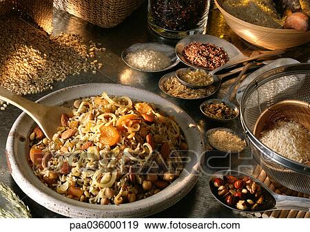 Cooked dish of rice with dried fruits and nuts, surrounded by various dry grains and seeds View Large Photo Image Stock Photo - Cooked dish of rice with dried fruits and nuts, surrounded by various dry grains and seeds. Fotosearch