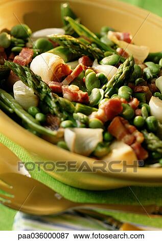 Dish of asparagus, peas and bacon in bowl, close-up View Large Photo Image Stock Photo - Dish of asparagus, peas and bacon in bowl, close-up. Fotosearch
