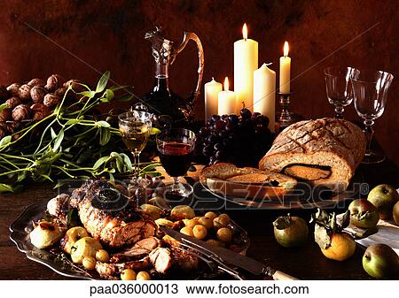 Dishes of meats, fruits and vegetables, with carafe of wine and candles in background View Large Photo Image Stock Image - Dishes of meats, fruits and vegetables, with carafe of wine and candles in background. Fotosearch