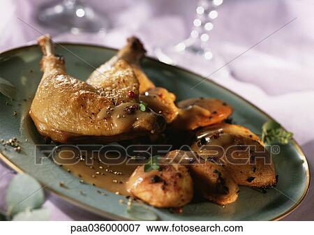 Duck leg with foie gras on dish, close-up View Large Photo Image Stock Photo - Duck leg with foie gras on dish, close-up. Fotosearch