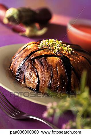 Eggplant cake on plate, topped with herbs, close-up View Large Photo Image Stock Image - Eggplant cake on plate, topped with herbs, close-up. Fotosearch