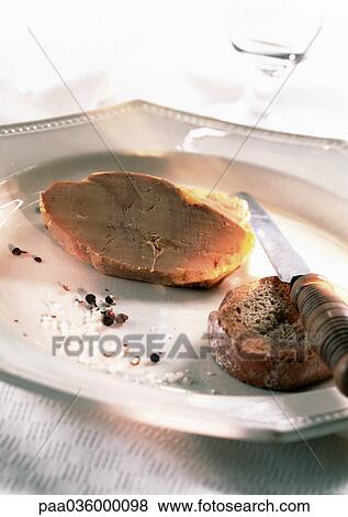 Foie gras, slice of bread, knife, and crumbs on plate, close-up View Large Photo Image Stock Photo - Foie gras, slice of bread, knife, and crumbs on plate, close-up. Fotosearch