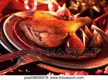 Leg of duck with figs on plate, close-up View Large Photo Image Stock Photo - Leg of duck with figs on plate, close-up. Fotosearch