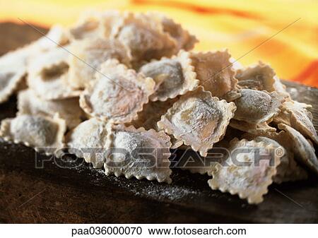 Mound of floured fresh ravioli, close-up View Large Photo Image Stock Image - Mound of floured fresh ravioli, close-up. Fotosearch