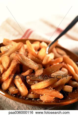 Mound of salted french fries on plate, close-up View Large Photo Image Stock Photograph - Mound of salted french fries on plate, close-up. Fotosearch