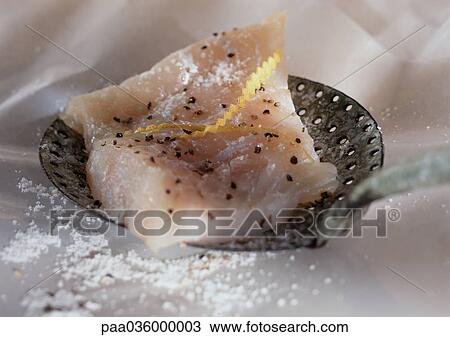 Piece of fresh cod sprinkled with salt and herbs, on skimmer, close-up View Large Photo Image Stock Image - Piece of fresh cod sprinkled with salt and herbs, on skimmer, close-up. Fotosearch