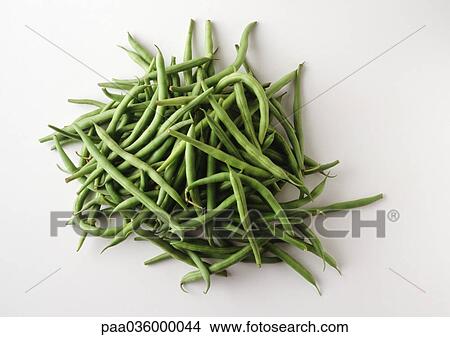Picture - Pile of string beans, white background. Fotosearch