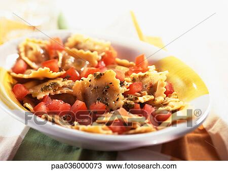 Plate of ravioli with tomatoes and basil, close-up View Large Photo Image Stock Image - Plate of ravioli with tomatoes and basil, close-up. Fotosearch
