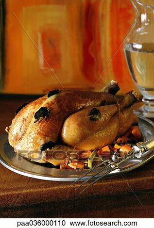 Roasted chicken garnished with truffles and vegetables, on dish View Large Photo Image Stock Image - Roasted chicken garnished with truffles and vegetables, on dish. Fotosearch