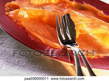 Slices of smoked salmon on plate with silverware, close-up View Large Photo Image Stock Image - Slices of smoked salmon on plate with silverware, close-up. Fotosearch