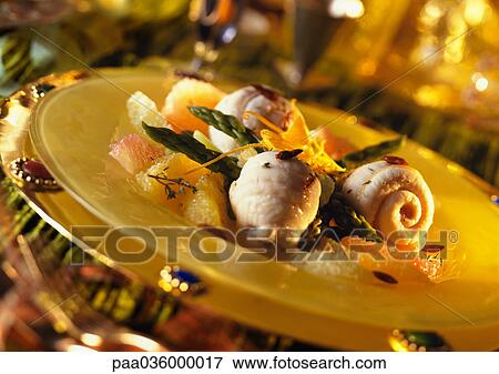 Sole with citrus fruits and asparagus on plate, close-up View Large Photo Image Stock Photo - Sole with citrus fruits and asparagus on plate, close-up. Fotosearch