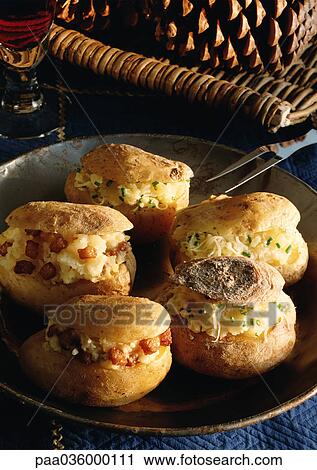 Stuffed potatoes on dish, close-up View Large Photo Image Stock Image - Stuffed potatoes on dish, close-up. Fotosearch
