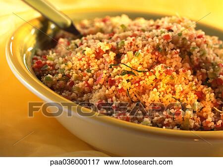 Tabouli in yellow bowl, partial view, close-up View Large Photo Image Stock Photo - Tabouli in yellow bowl, partial view, close-up. Fotosearch