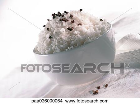 White bowl of white rice sprinkled with a spice, close-up View Large Photo Image Picture - White bowl of white rice sprinkled with a spice, close-up. Fotosearch