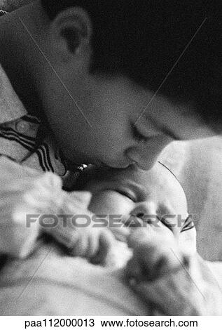 Boy kissing baby, close-up, b&w View Large Photo Image Stock Image - Boy kissing baby, close-up, b&w. Fotosearch