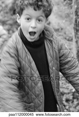 Boy looking into camera, b&w View Large Photo Image Stock Photography - Boy looking into camera, b&w. Fotosearch