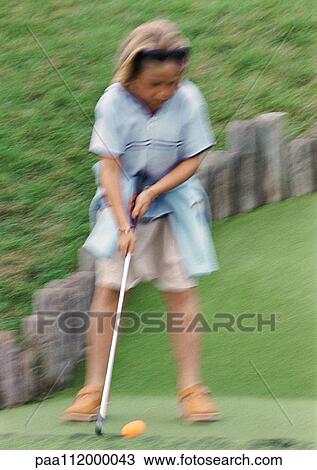 Girl playing golf, blurred View Large Photo Image Stock Image - Girl playing golf, blurred. Fotosearch