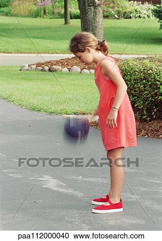 Girl playing with ball outside, side view, blurred motion View Large Photo Image Stock Image - Girl playing with ball outside, side view, blurred motion. Fotosearch