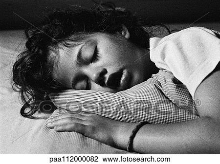 Stock Image - Girl sleeping, close-up, b&w. Fotosearch