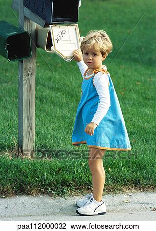 Girl standing in front of mailbox, looking into camera View Large Photo Image Stock Image - Girl standing in front of mailbox, looking into camera. Fotosearch