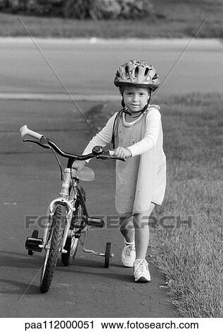 Girl walking with bike, b&w View Large Photo Image Stock Image - Girl walking with bike, b&w. Fotosearch