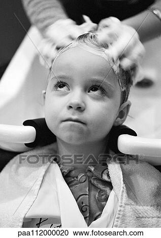 Stock Image - Little girl being shampooed, b&w. Fotosearch