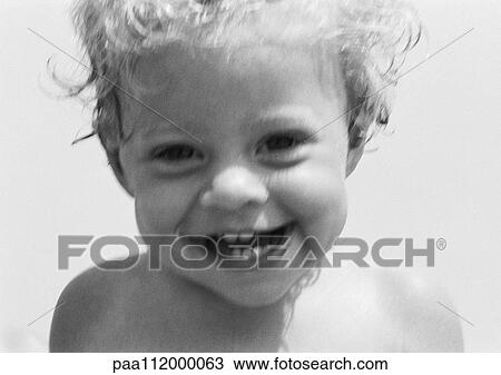 Stock Image - Little girl smiling, b&w. Fotosearch