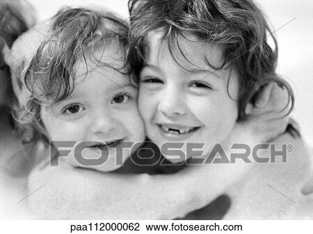 Two girls hugging in bathtub, portrait, b&w View Large Photo Image Stock Image - Two girls hugging in bathtub, portrait, b&w. Fotosearch