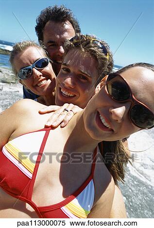 Close-up of family at the beach. View Large Photo Image Stock Photography - Close-up of family at the beach.. Fotosearch