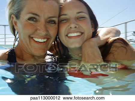 Close-up of woman and teenager in a pool. View Large Photo Image Stock Image - Close-up of woman and teenager in a pool.. Fotosearch
