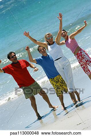 Family on beach, waving View Large Photo Image Stock Photo - Family on beach, waving. Fotosearch