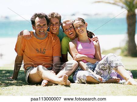 Family portrait at the beach, front view. View Large Photo Image Stock Photo - Family portrait at the beach, front view.. Fotosearch