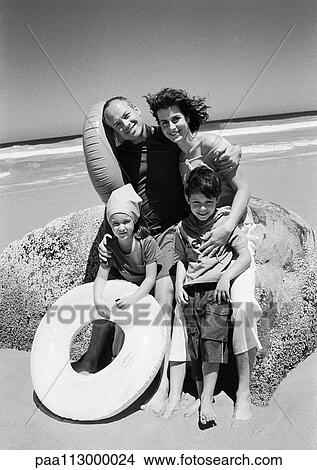 Family portrait at the beach, frontal view, B&W. View Large Photo Image Picture - Family portrait at the beach, frontal view, B&W.. Fotosearch