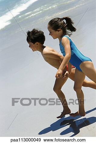 Little boy and girl running on the beach. View Large Photo Image Stock Photo - Little boy and girl running on the beach.. Fotosearch