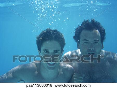 Man and teenage boy underwater. View Large Photo Image Stock Photo - Man and teenage boy underwater.. Fotosearch