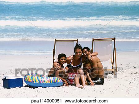 Family posing for photo on beach View Large Photo Image Stock Image - Family posing for photo on beach. Fotosearch
