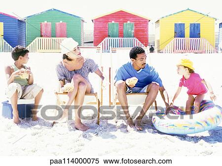Family sitting on beach View Large Photo Image Stock Photography - Family sitting on beach. Fotosearch