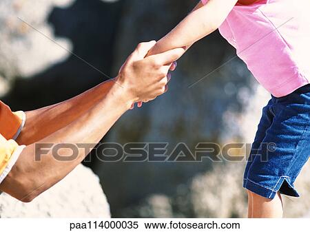 Stock Photography - Man holding daughter's hand. Fotosearch