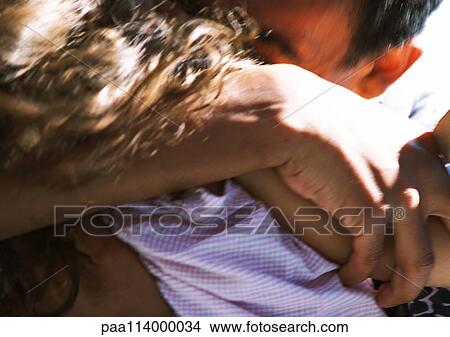 Man hugging daughter, close-up View Large Photo Image Picture - Man hugging daughter, close-up. Fotosearch