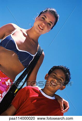 Woman and boy, low angle view, close-up View Large Photo Image Stock Image - Woman and boy, low angle view, close-up. Fotosearch