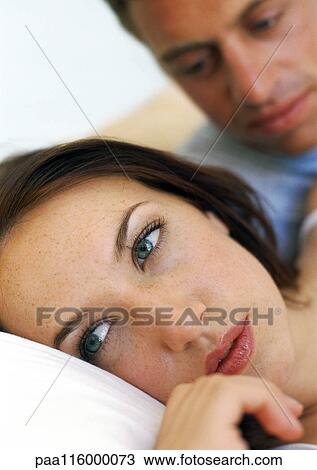 Couple in bed, close-up View Large Photo Image Stock Image - Couple in bed, close-up. Fotosearch