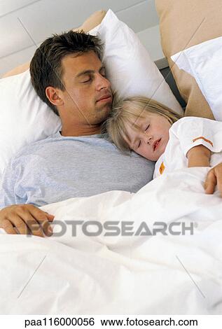 Father and daughter sleeping in bed View Large Photo Image Stock Photograph - Father and daughter sleeping in bed. Fotosearch