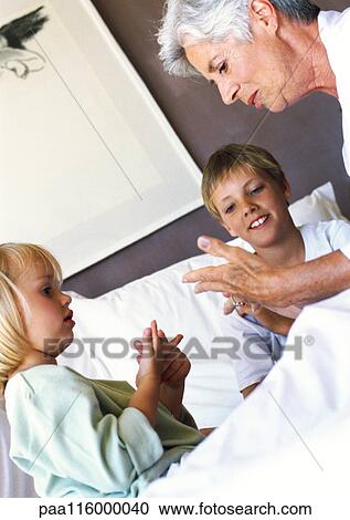 Grandmother and children in bed View Large Photo Image Stock Image - Grandmother and children in bed. Fotosearch