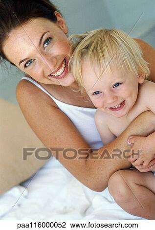 Mother hugging baby, smiling View Large Photo Image Stock Image - Mother hugging baby, smiling. Fotosearch