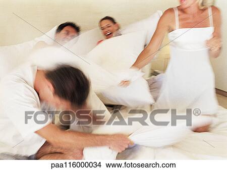 People having pillow fight, blurred motion View Large Photo Image Picture - People having pillow fight, blurred motion. Fotosearch